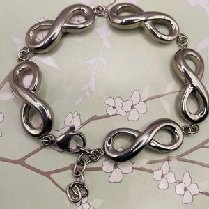 Silver Tone Infinity Link Bracelet. Stainless Steel. 7 to 8 inches long